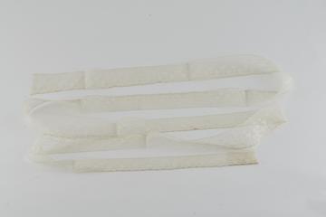 Piece of cream border lace with scalloped edge