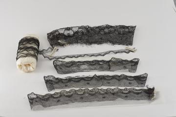Eight Pieces of Black Chantilly Lace Trimming.