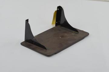 Wooden shelf with black-painted metal brackets