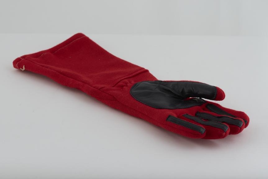 One of a pair of racing driver's gloves as used by Alan Jones