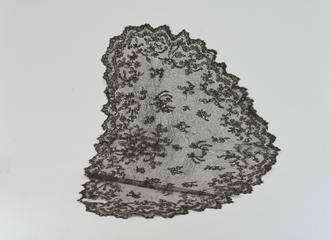 Black lace head-covering with scalloped edge