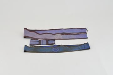 Two hat band ribbons and a bow