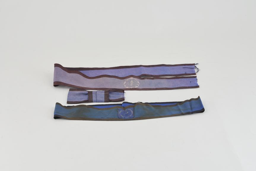 Two hat band ribbons and a bow