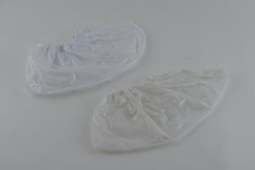 Pair of 3-ply disposable overshoes in tissue-polythene-tissue