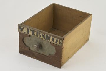 Wooden drawer with one painted label