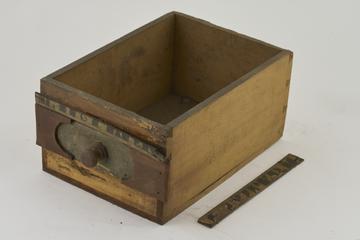 Wooden drawer witth only one painted label