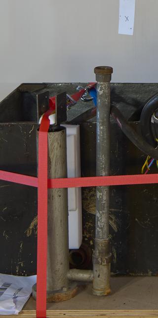Mounted pipe and bracket for replica Newcomen engine