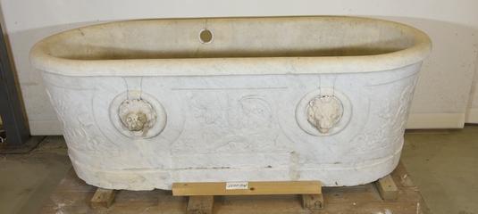 Decorated carved stone bath