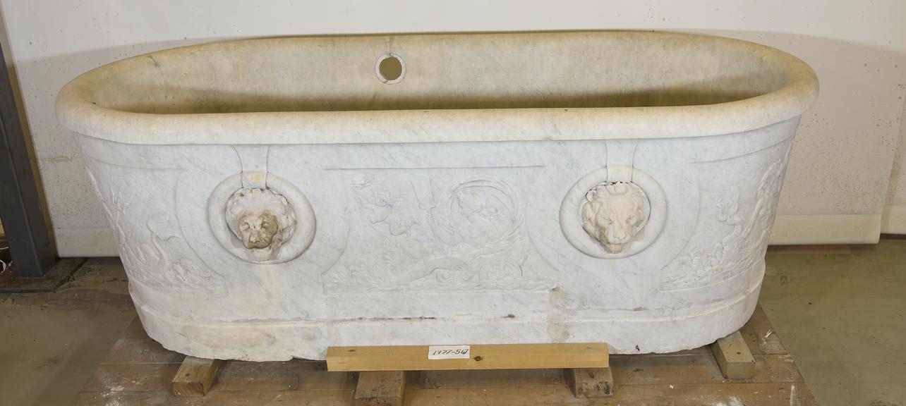 Decorated carved stone bath