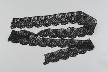 Length of deep black border lace with scalloped edge