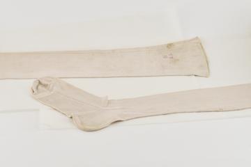 A Pair of Thick Cream Silk Stockings with Monogram V.R.