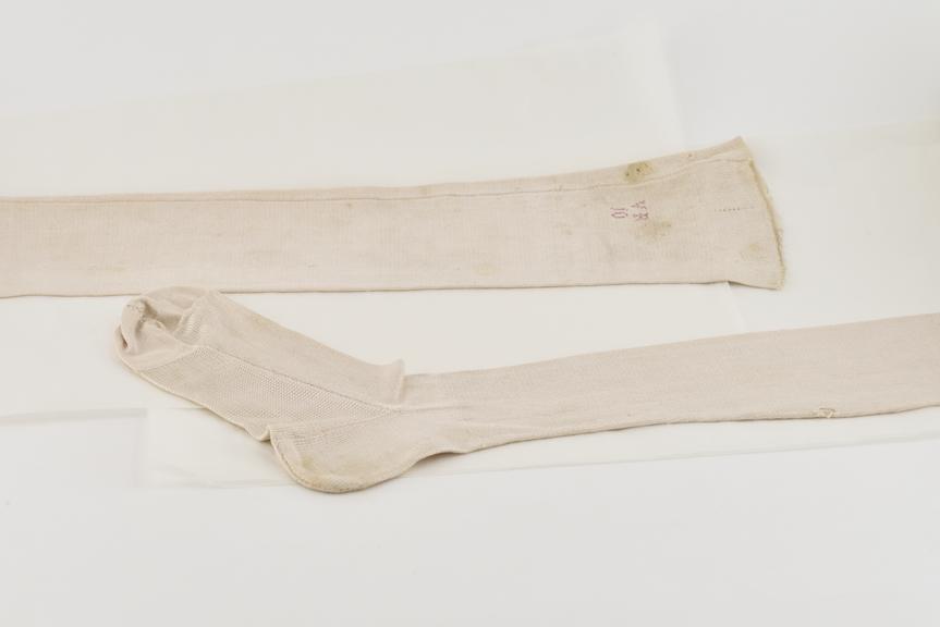 A Pair of Thick Cream Silk Stockings with Monogram V.R.