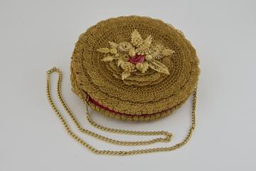 Twisted straw handbag with applied straw floral decoration