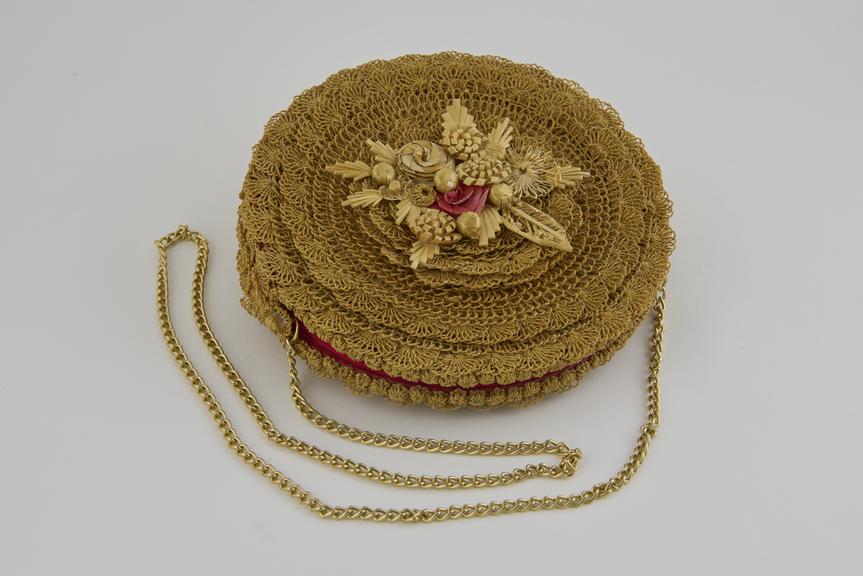Twisted straw handbag with applied straw floral decoration