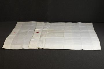 Two nurses caps embroidered with red cross