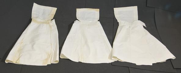Three White Linen Aprons with Pin-up Bibs.