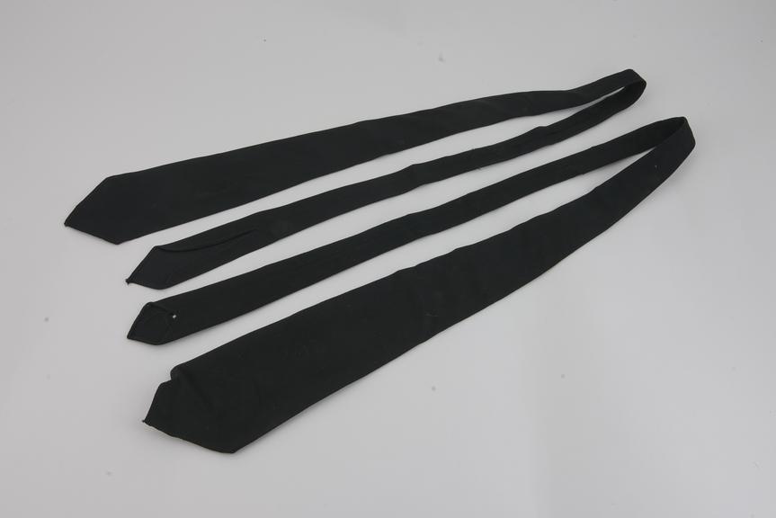 Two Black Ties, part of Nursing Uniform.