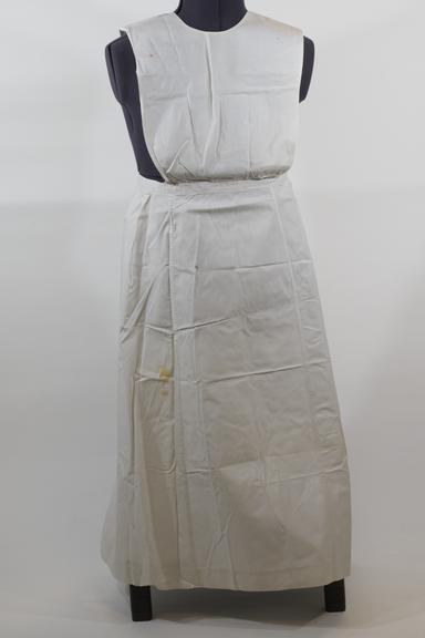 White linen apron with round bib
