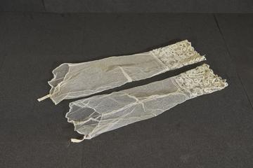 Pair of lace cuffs attached to mesh sleeves