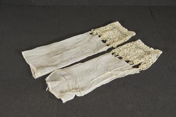 Pair of lace cuffs attached to muslin sleeves