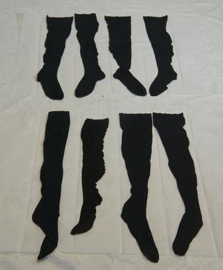 Four Pairs of Black Seamed Stockings.