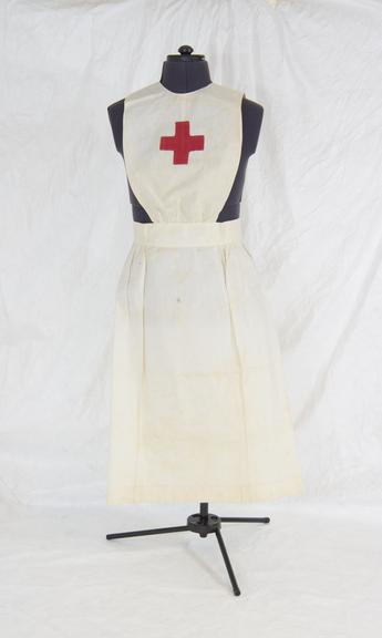 White cotton apron with a red cross