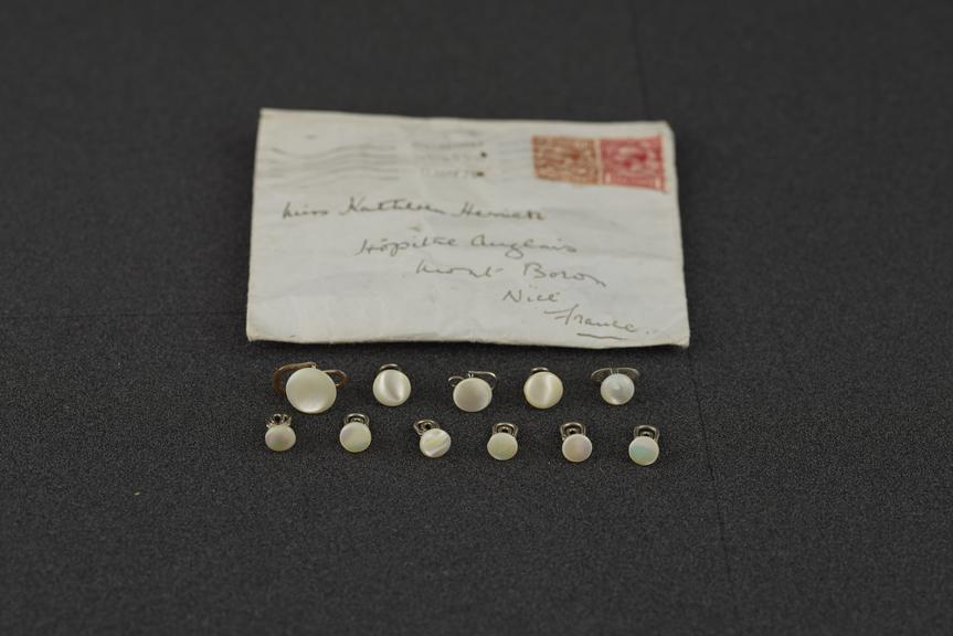 Envelope containing eleven pearl buttons, England, 1920