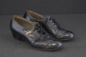 Pair of black leather lace-up women's shoes