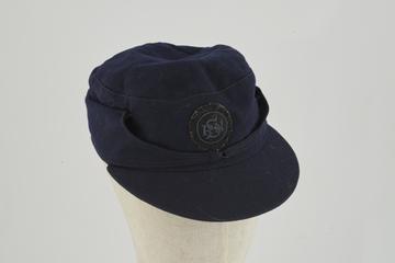 Dark blue serge cap with stiffened eye shade and badge
