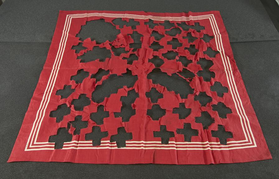 Large red cloth handkerchief from which Red Crosses were cut for nurses at Dar-es-Salaam