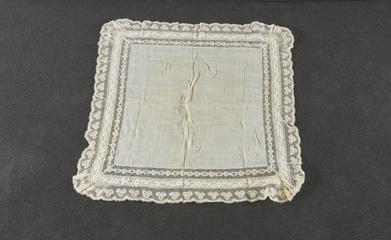 Square handkerchief with deep border of old lace scalloped at edge