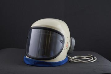 Clean air helmet of polyester resin impregnated glass fibre