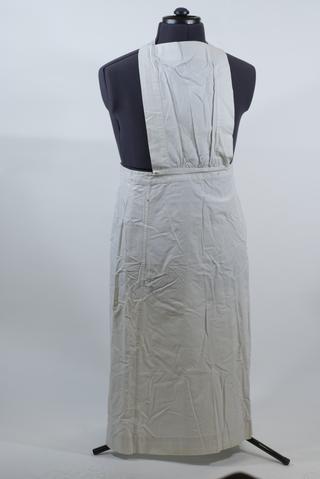 White linen apron with square bib and cross-straps