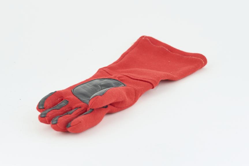 One of a pair of racing driver's gloves as used by Alan Jones