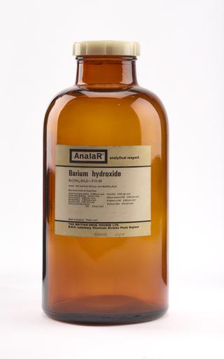 An empty brown glass bottle for barium hydroxide.