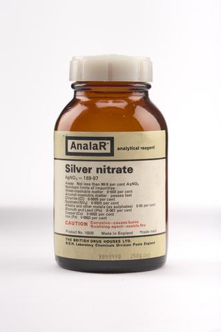 An empty brown glass bottle for silver nitrate.