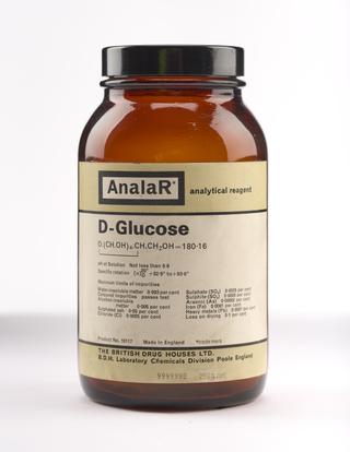 An empty brown glass bottle for d-glucose