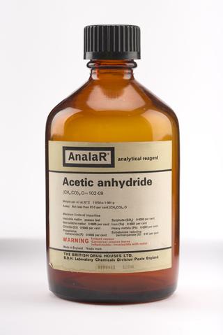An empty brown glass bottle for acetic anhydride.