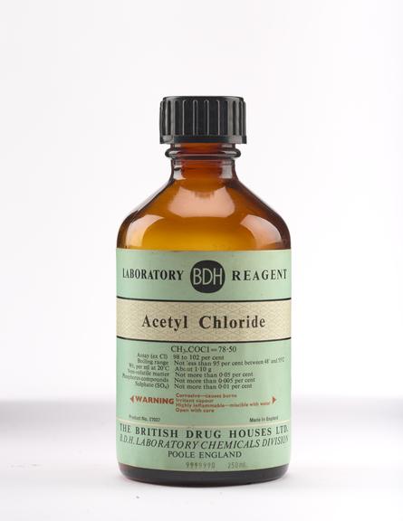 An empty brown glass bottle for acetyl chloride.
