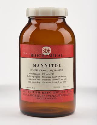 An empty brown glass bottle for mannitol.