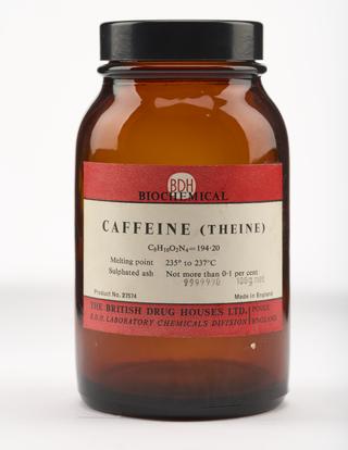 An empty brown glass bottle for caffeine.