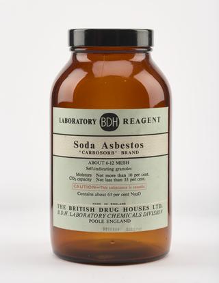 An empty brown glass bottle for soda asbestos.
