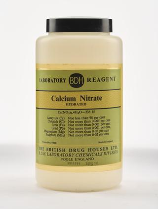 An empty plastic bottle for calcium nitrate.