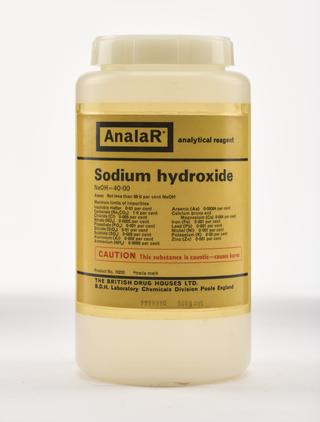 An empty polythene bottle for sodium hydroxide.
