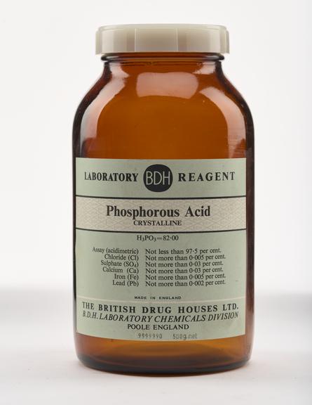 An empty brown glass bottle for phosphorous acid.