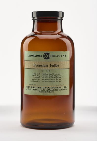 An empty brown glass bottle for potassium iodide.