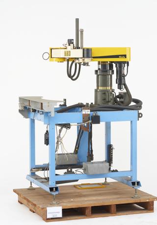 Robot and workholding device on stand