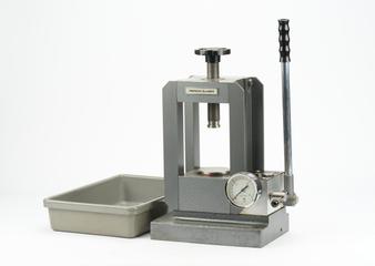 Press for making potassium bromide discs for infrared spectroscopy.