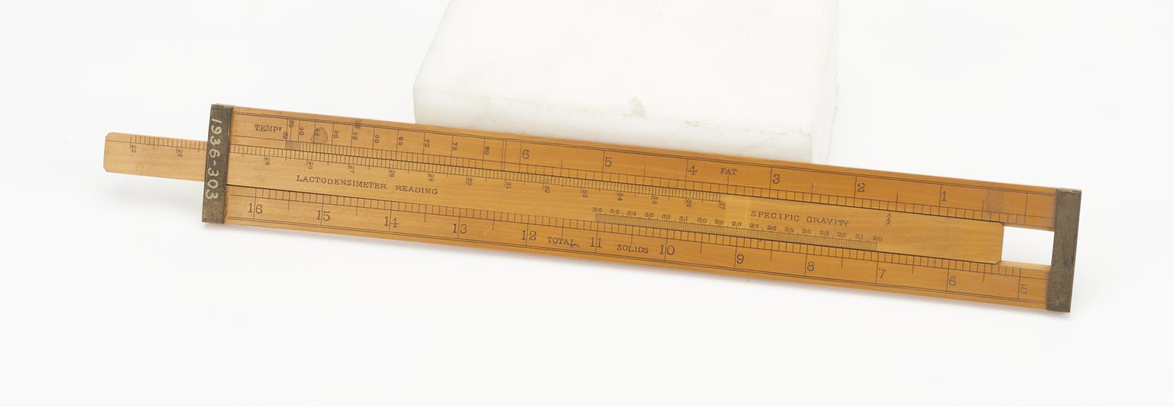 Slide rule for milk testing apparatus