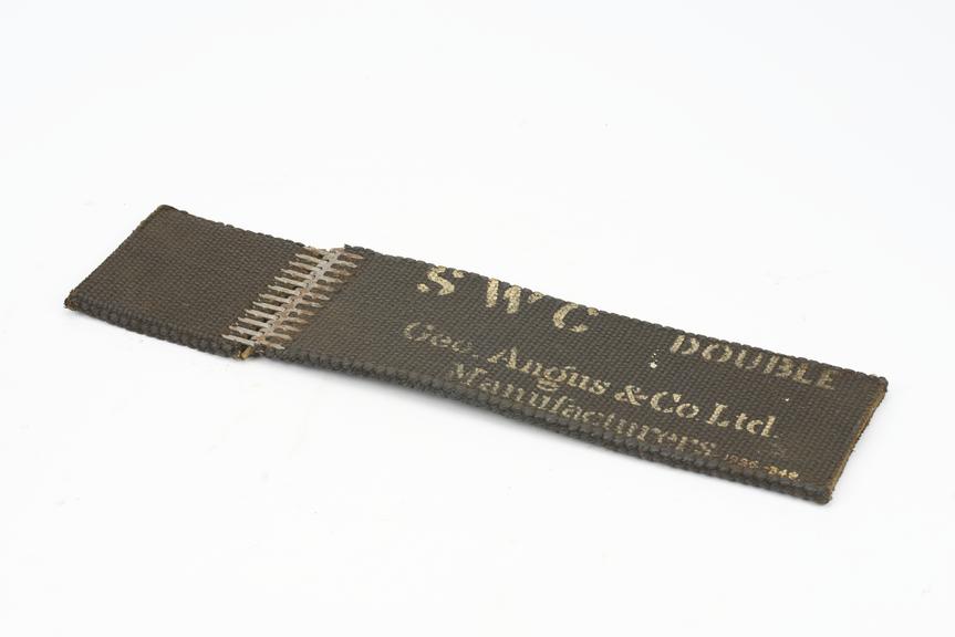 Length of solid woven cotton belt double substance, joined with alligator fastener and rawhide pin
